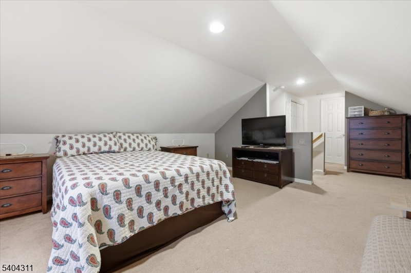 24 Ozone Avenue Cedar Grove, NJ 07009 - Photo 17 of 36 a bedroom with a bed and television