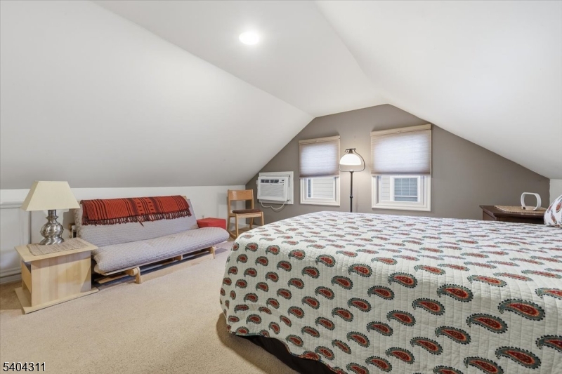 24 Ozone Avenue Cedar Grove, NJ 07009 - Photo 18 of 36 a bedroom with a bed and a lamp