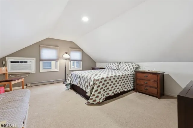 a bedroom with a bed and dresser