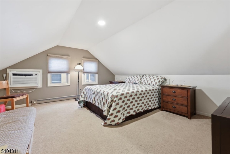 24 Ozone Avenue Cedar Grove, NJ 07009 - Photo 19 of 36 a bedroom with a bed and dresser