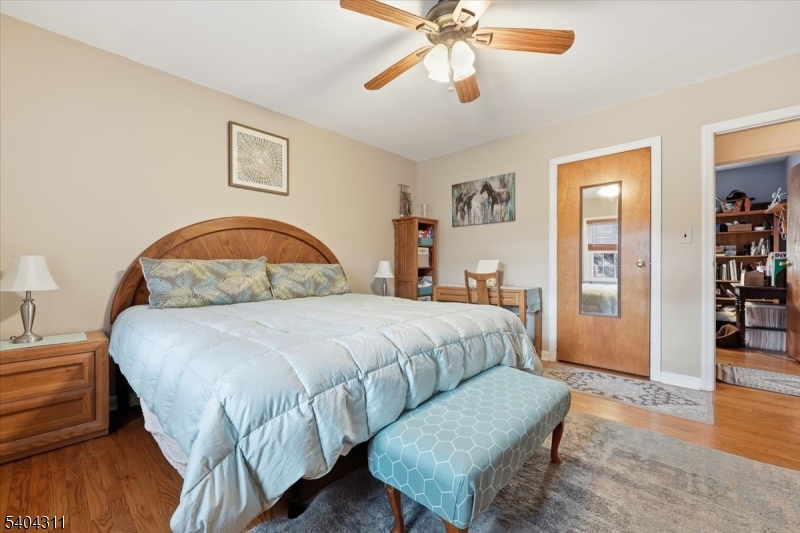 24 Ozone Avenue Cedar Grove, NJ 07009 - Photo 22 of 36 a bedroom with a bed and wooden floor