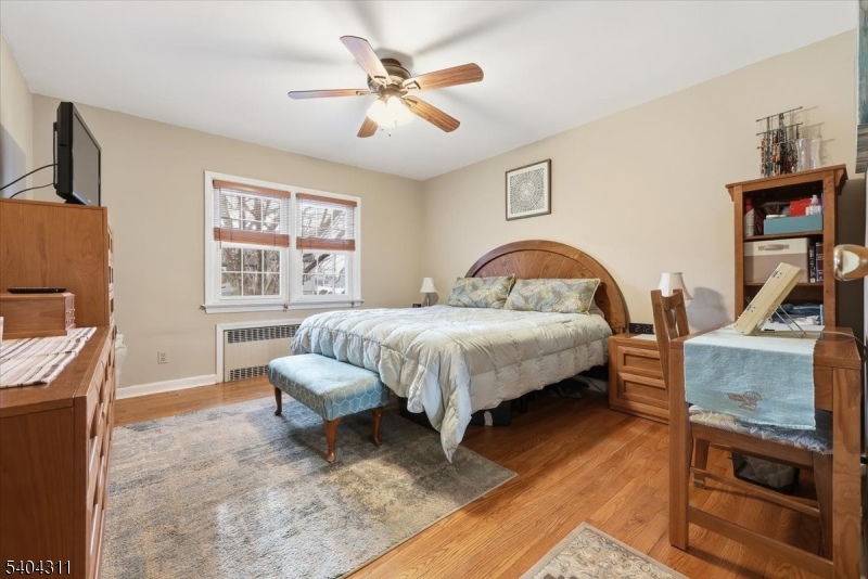 24 Ozone Avenue Cedar Grove, NJ 07009 - Photo 23 of 36 a bedroom with a bed a couch and dresser