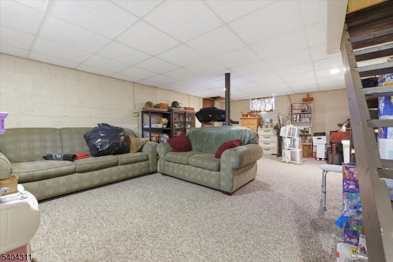 24 Ozone Avenue Cedar Grove, NJ 07009 - Photo 26 of 36 a living room with furniture and a couch