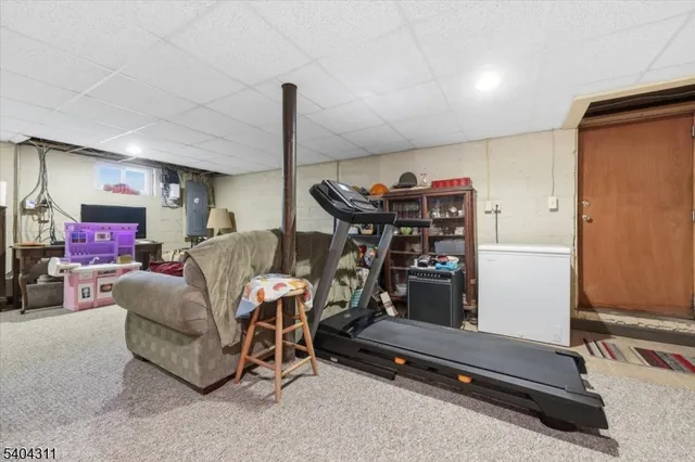 a room with furniture and a flat screen tv
