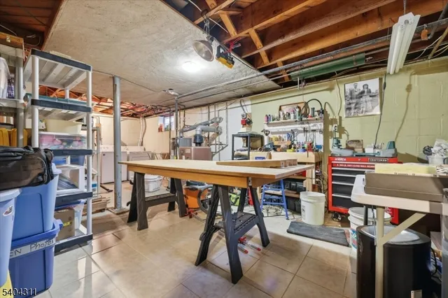 a utility room with lots of wooden furniture