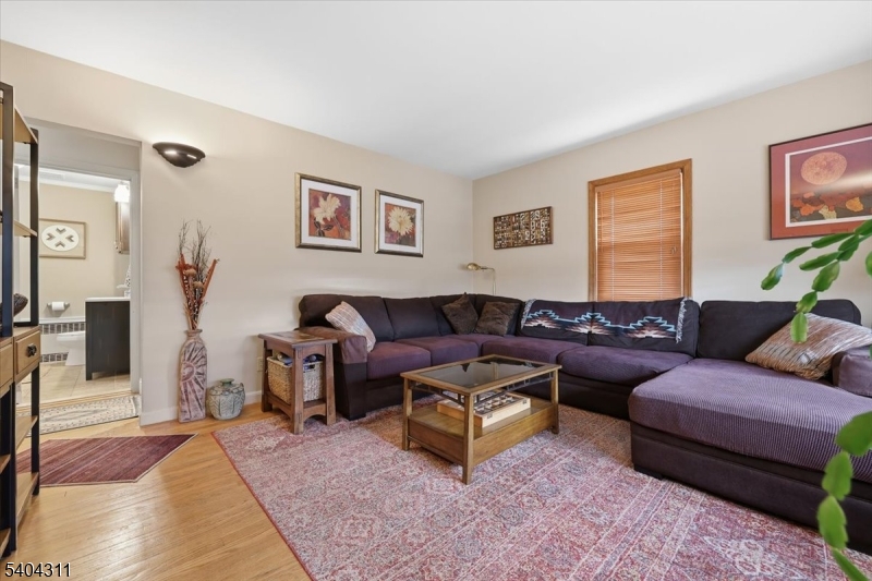 24 Ozone Avenue Cedar Grove, NJ 07009 - Photo 4 of 36 a living room with furniture and wooden floor