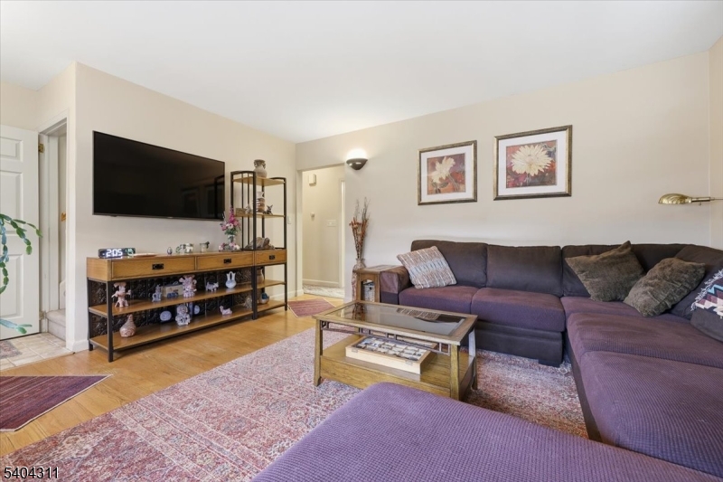 24 Ozone Avenue Cedar Grove, NJ 07009 - Photo 6 of 36 a living room with furniture and a flat screen tv