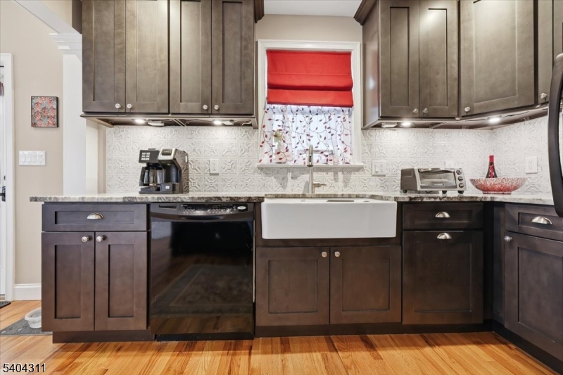 24 Ozone Avenue Cedar Grove, NJ 07009 - Photo 10 of 36 a kitchen with a sink cabinets and window