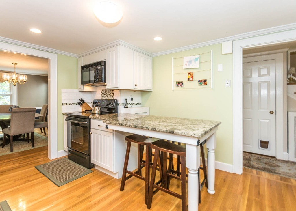 8 Nobscot Road Wellesley, MA 02482 - Photo 8 of 28 a kitchen with a stove a sink and a refrigerator