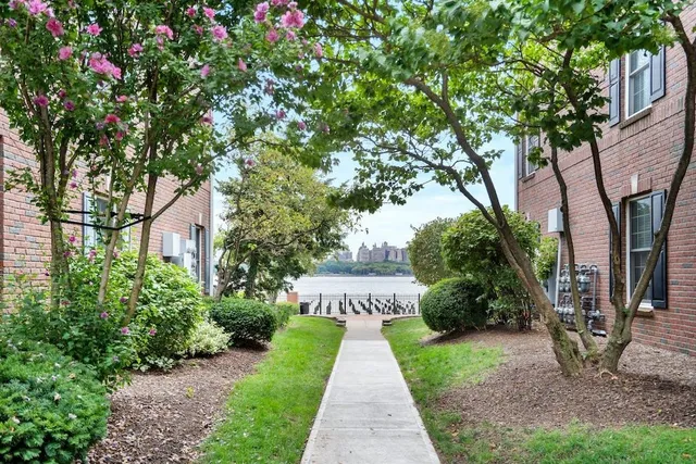 a view of a pathway with a house in the background