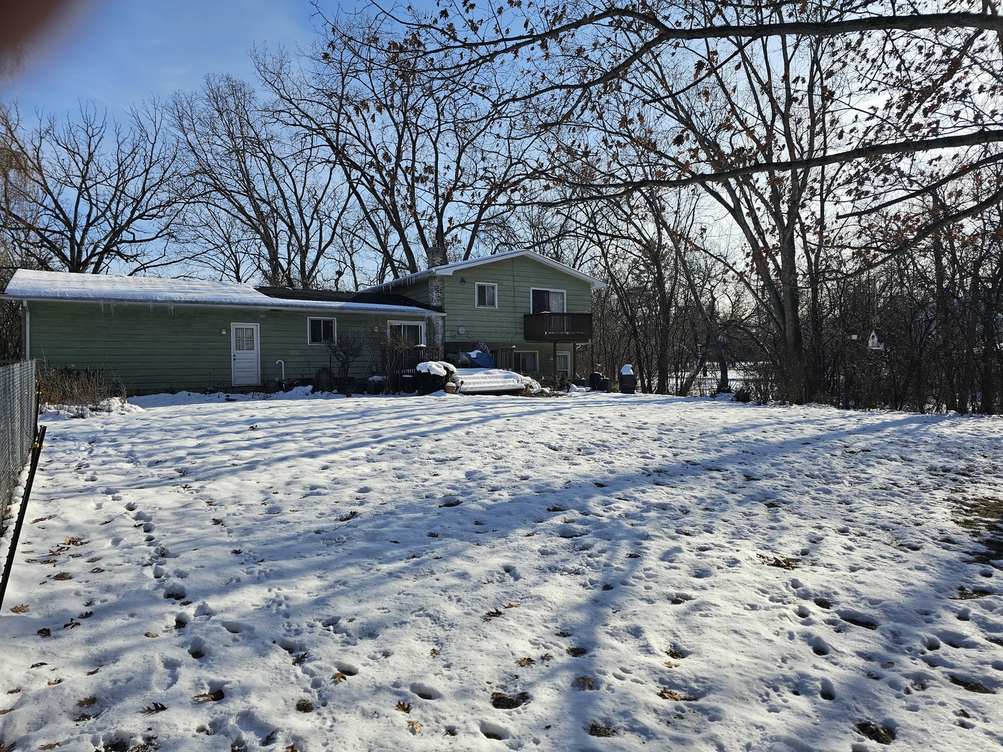 26890 North Longwood Road Lake Forest, IL 60045 - Photo 12 of 15 a front view of house with yard covered in snow