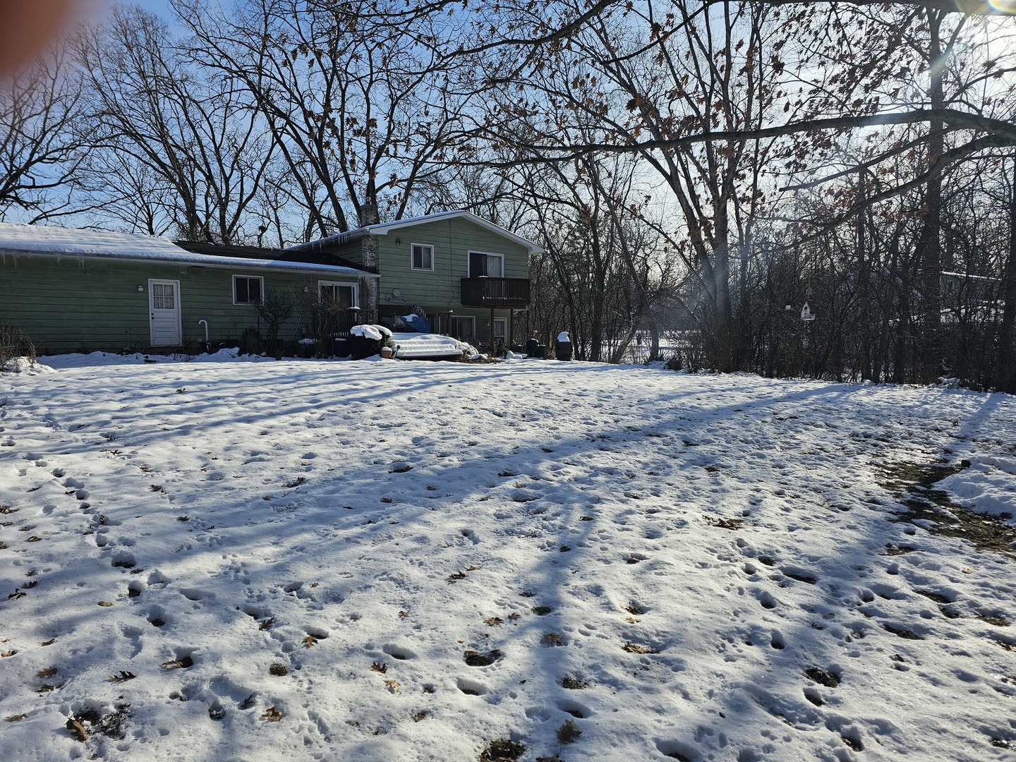 26890 North Longwood Road Lake Forest, IL 60045 - Photo 14 of 15 a view of a house with a yard covered in snow