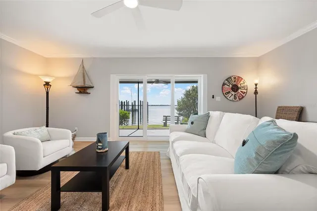 a living room with furniture rug and a large window