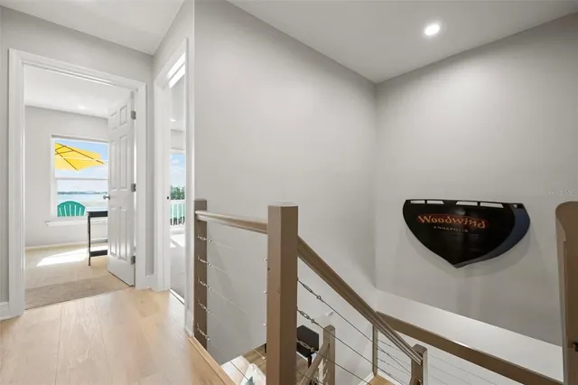 a view of a hallway and a livingroom with furniture