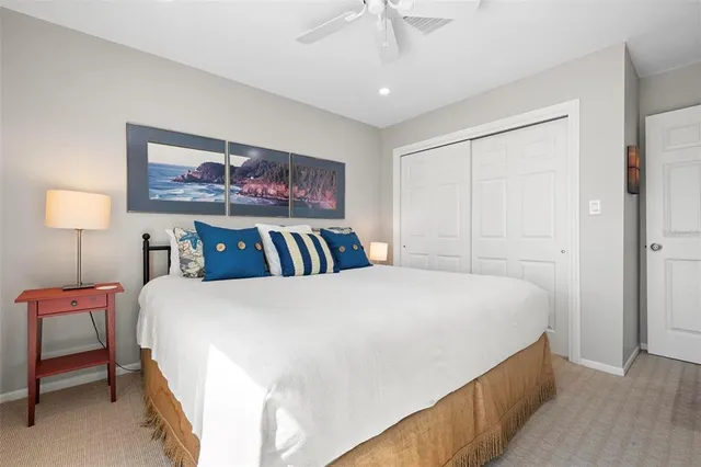 a bedroom with bed and a chandelier