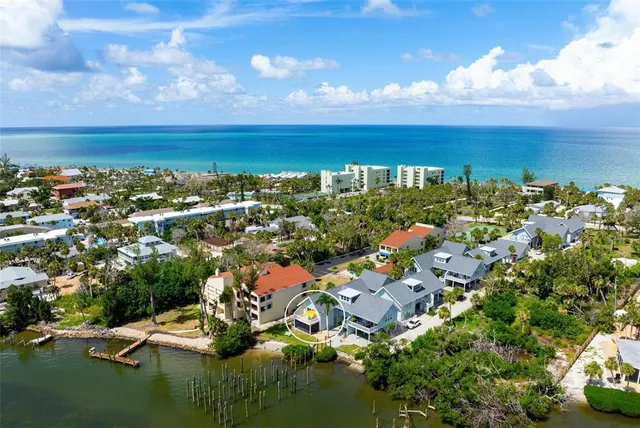 an aerial view of residential building and lake