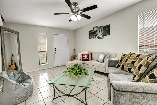a living room with furniture and a large window