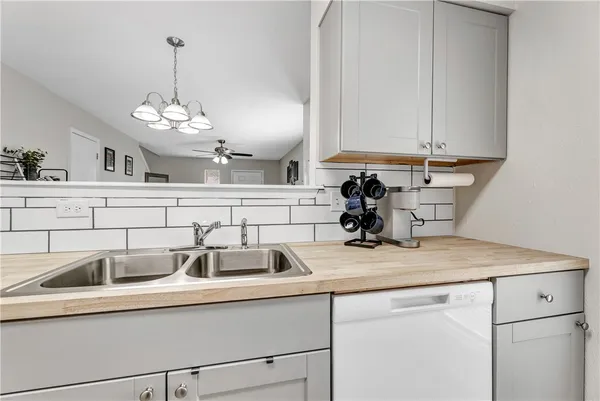 a kitchen with a sink and cabinets