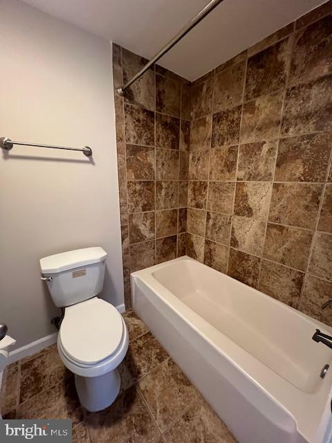 18120 Chalet Drive, Unit 11301 Germantown, MD 20874 - Photo 11 of 15 a bathroom with a toilet and a bathtub