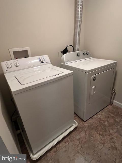 18120 Chalet Drive, Unit 11301 Germantown, MD 20874 - Photo 14 of 15 a utility room with dryer and washer