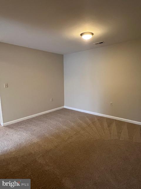 18120 Chalet Drive, Unit 11301 Germantown, MD 20874 - Photo 7 of 15 a view of an empty room and has a window