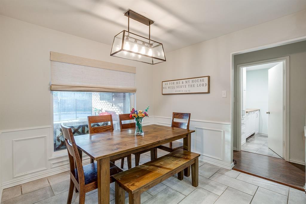 1804 Longbranch Court Arlington, TX 76012 - Photo 14 of 33 a view of a dining room with furniture a chandelier and wooden floor