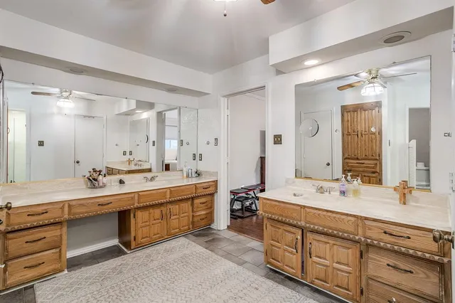 a bathroom with a sink and mirror