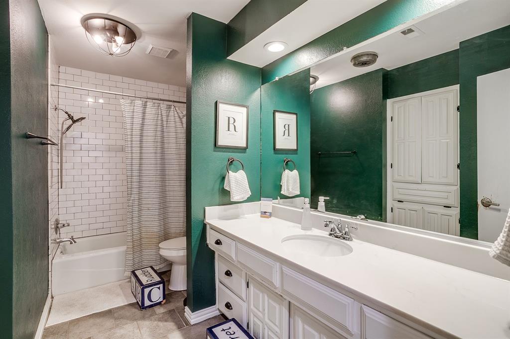 1804 Longbranch Court Arlington, TX 76012 - Photo 20 of 33 a bathroom with a sink double vanity and a mirror