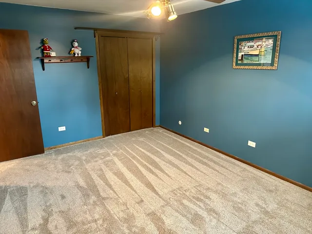 a bed room with a bed and a table