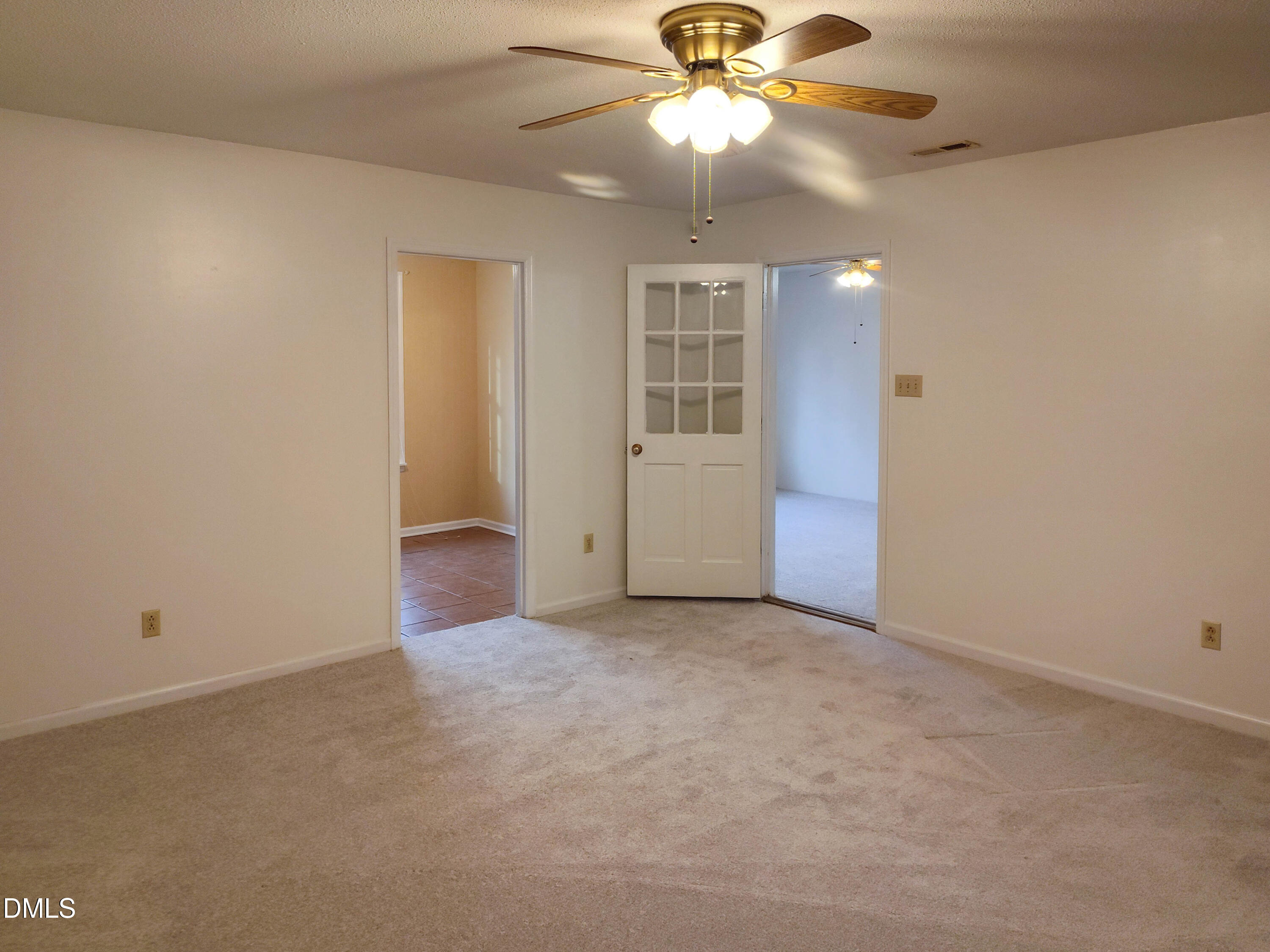 205 Darrel Road La Grange, NC 28551 - Photo 11 of 44 an empty room with closet and a chandelier fan