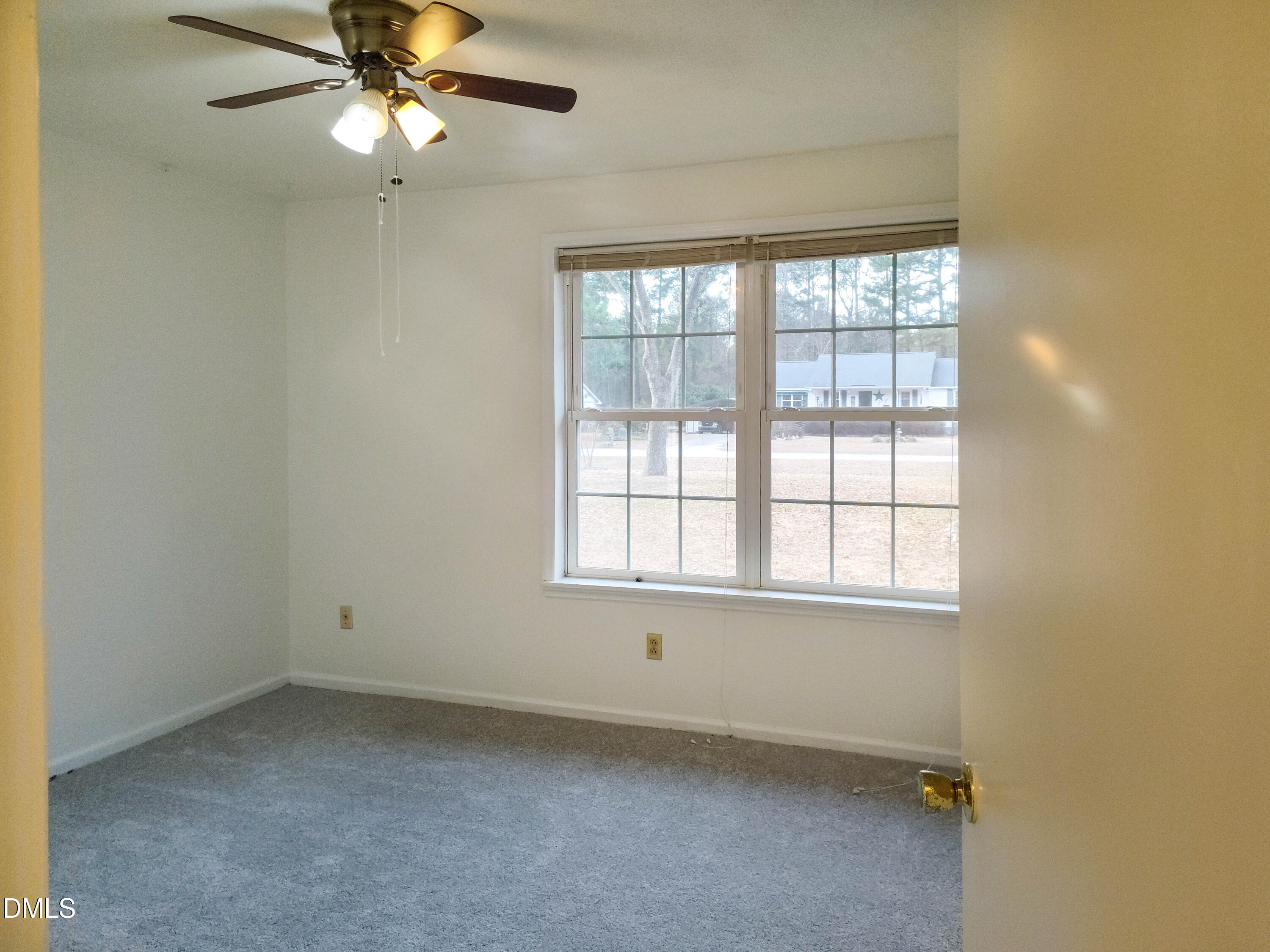 205 Darrel Road La Grange, NC 28551 - Photo 19 of 44 an empty room with a window and a fan