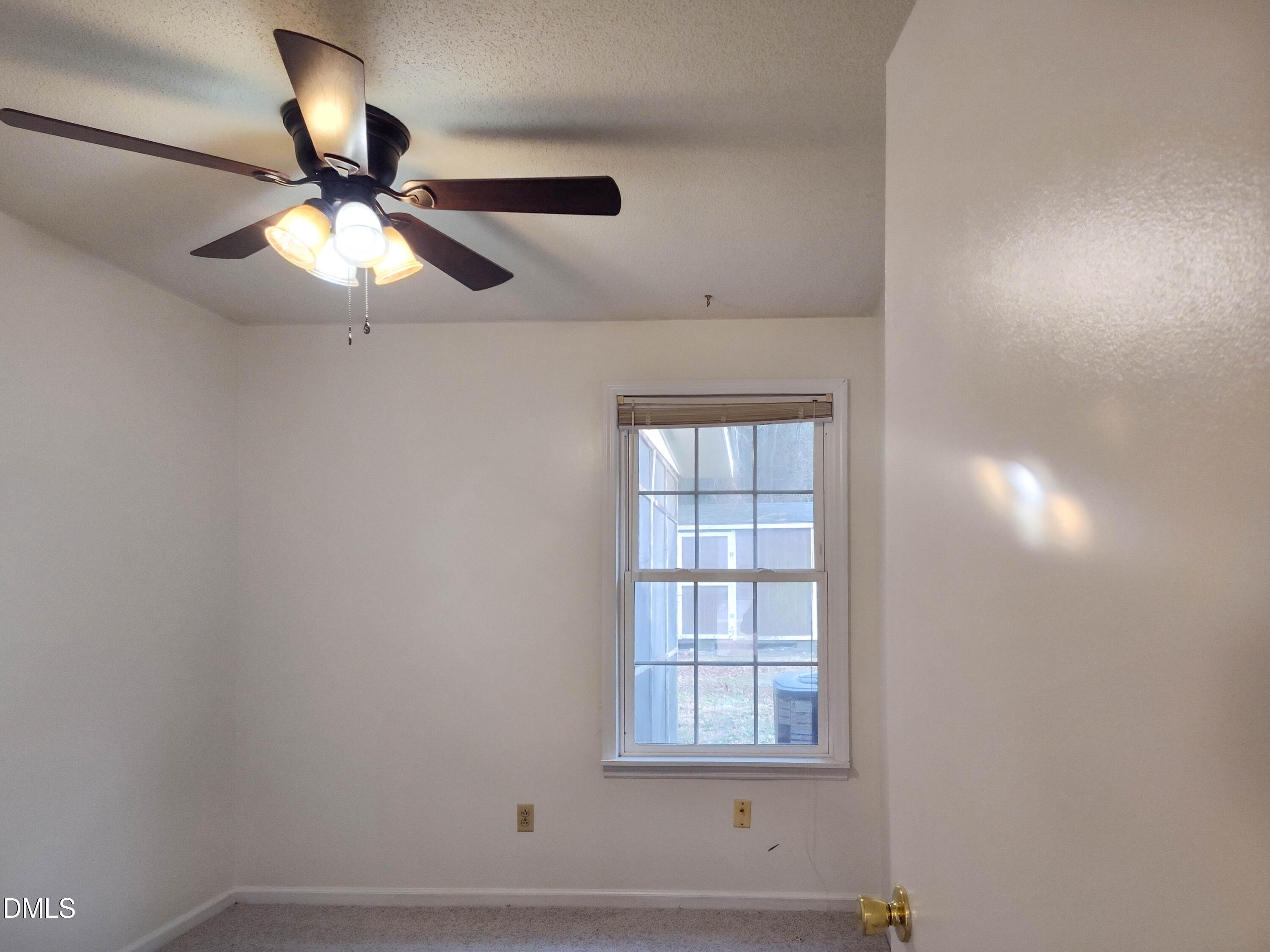205 Darrel Road La Grange, NC 28551 - Photo 27 of 44 an empty room with a window and a ceiling fan