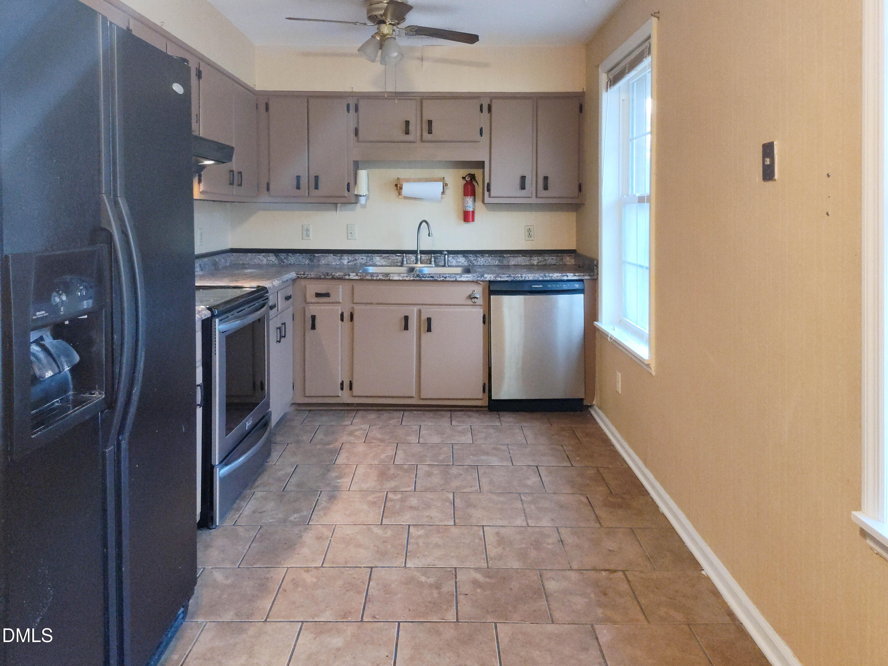 205 Darrel Road La Grange, NC 28551 - Photo 3 of 44 a kitchen with a sink a refrigerator and cabinets
