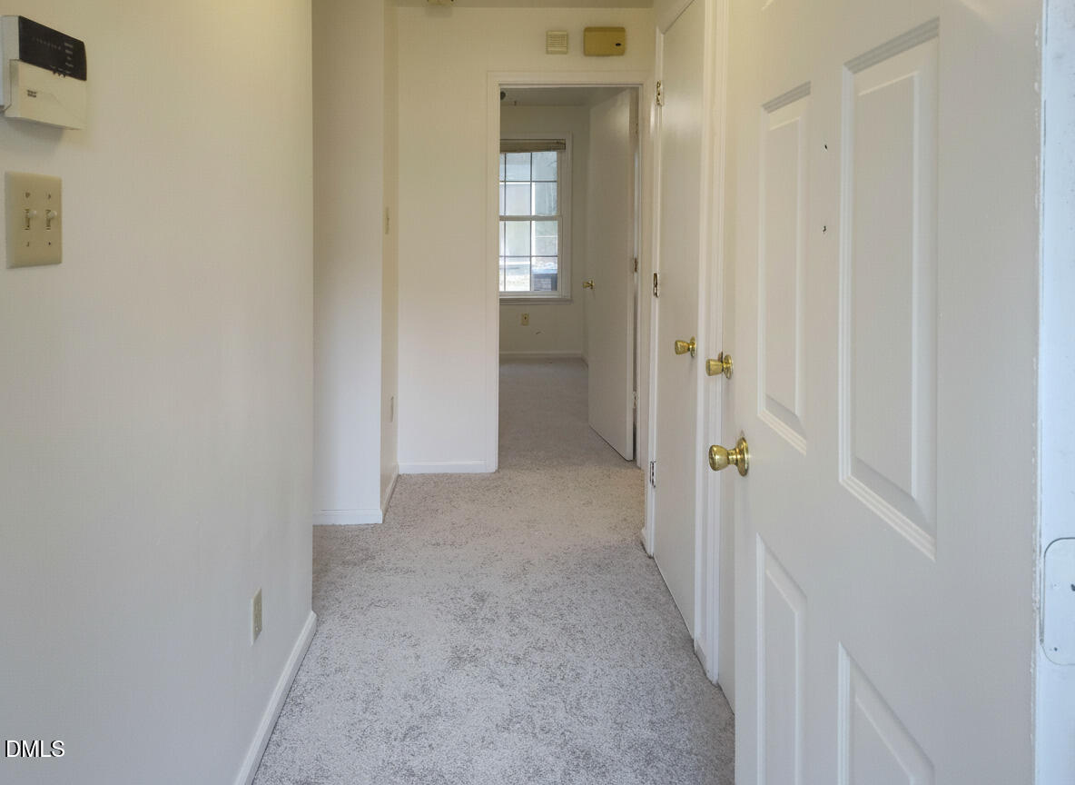 205 Darrel Road La Grange, NC 28551 - Photo 35 of 44 a view of a hallway with wooden shelves
