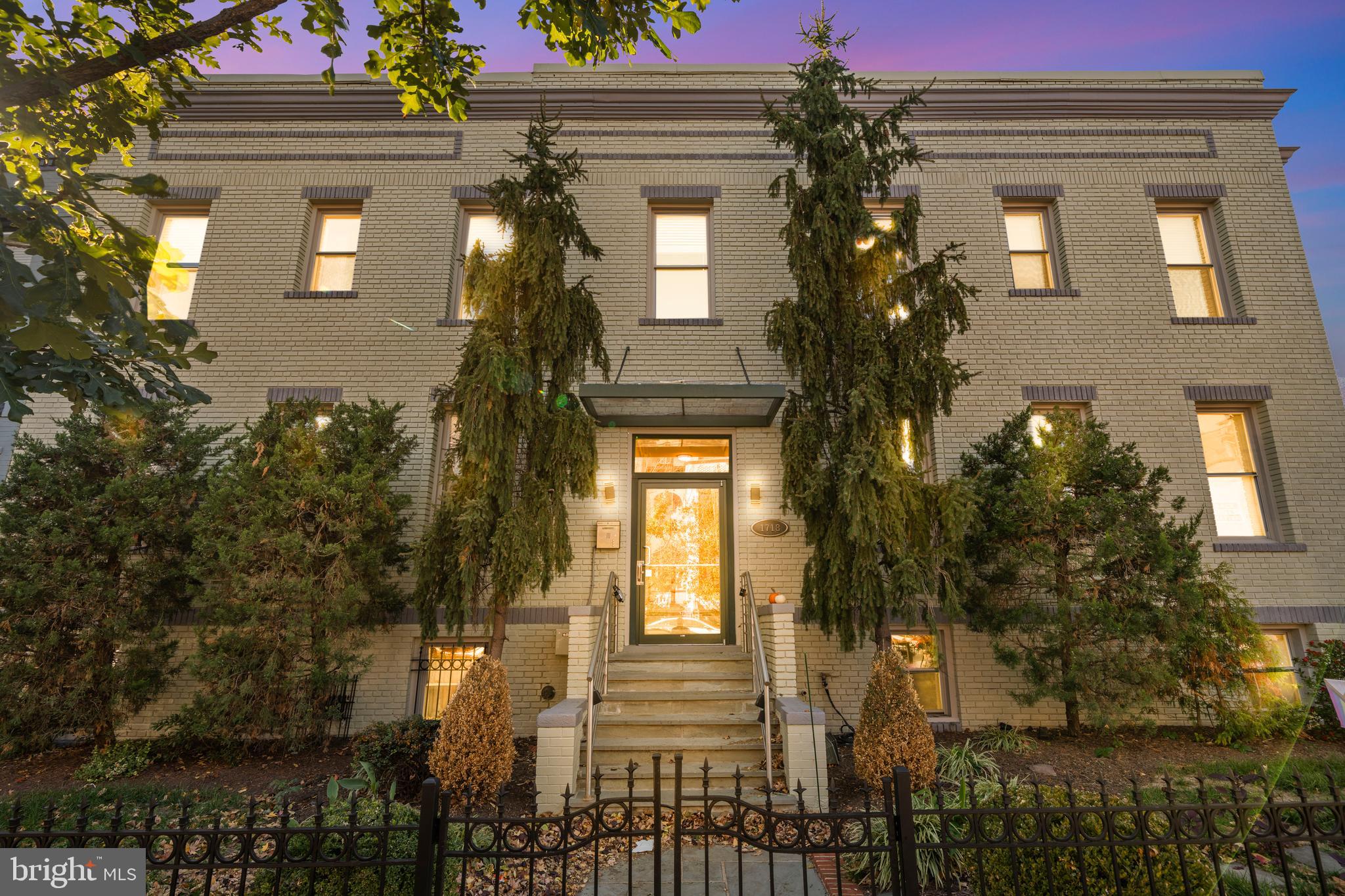 a view of a house with large windows