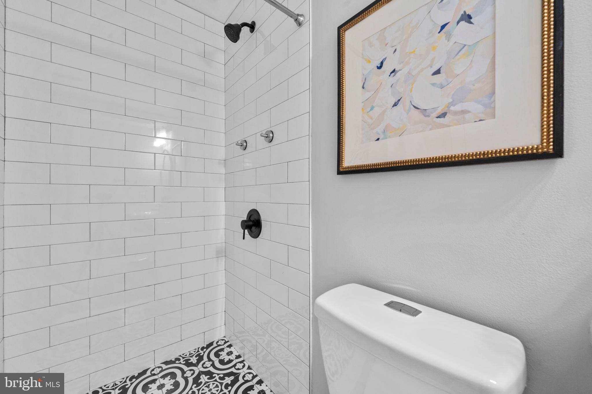 1718 1st Street Northwest, Unit 8 Washington, DC 20001 - Photo 12 of 25 a bathroom with a toilet and a shower