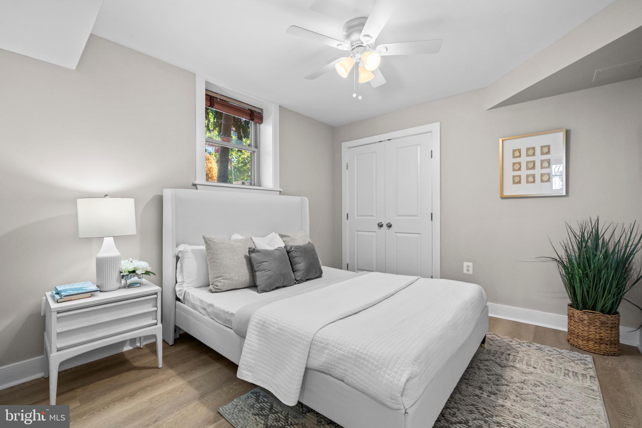 1718 1st Street Northwest, Unit 8 Washington, DC 20001 - Photo 13 of 25 a bedroom with a bed and a chandelier