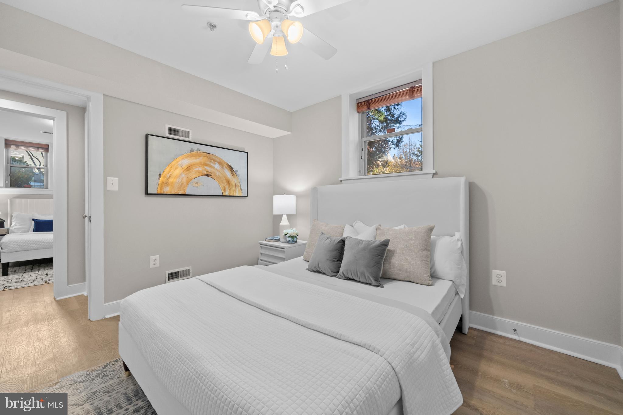 1718 1st Street Northwest, Unit 8 Washington, DC 20001 - Photo 14 of 25 a bedroom with a bed and a chandelier