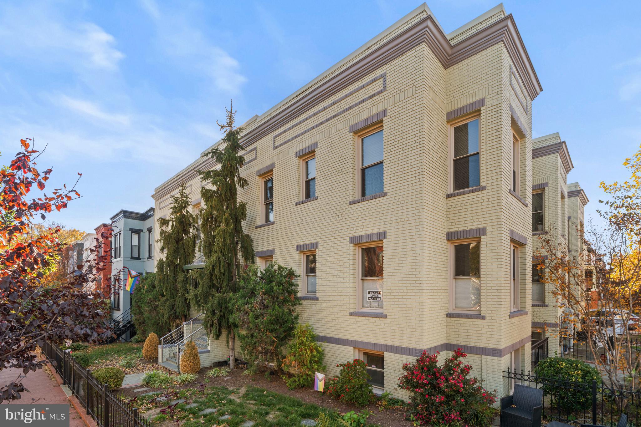 1718 1st Street Northwest, Unit 8 Washington, DC 20001 - Photo 24 of 25 a front view of a house with a yard