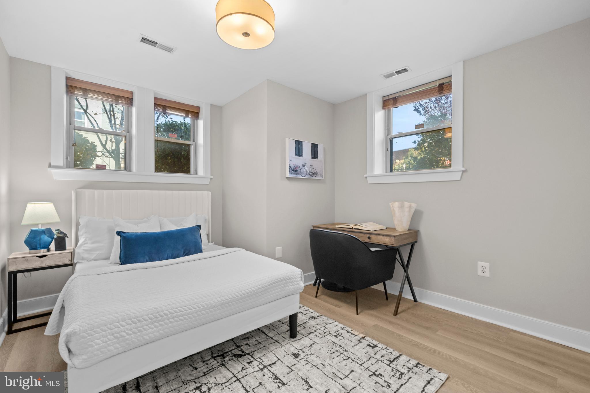 1718 1st Street Northwest, Unit 8 Washington, DC 20001 - Photo 8 of 25 a bedroom with a bed and a window