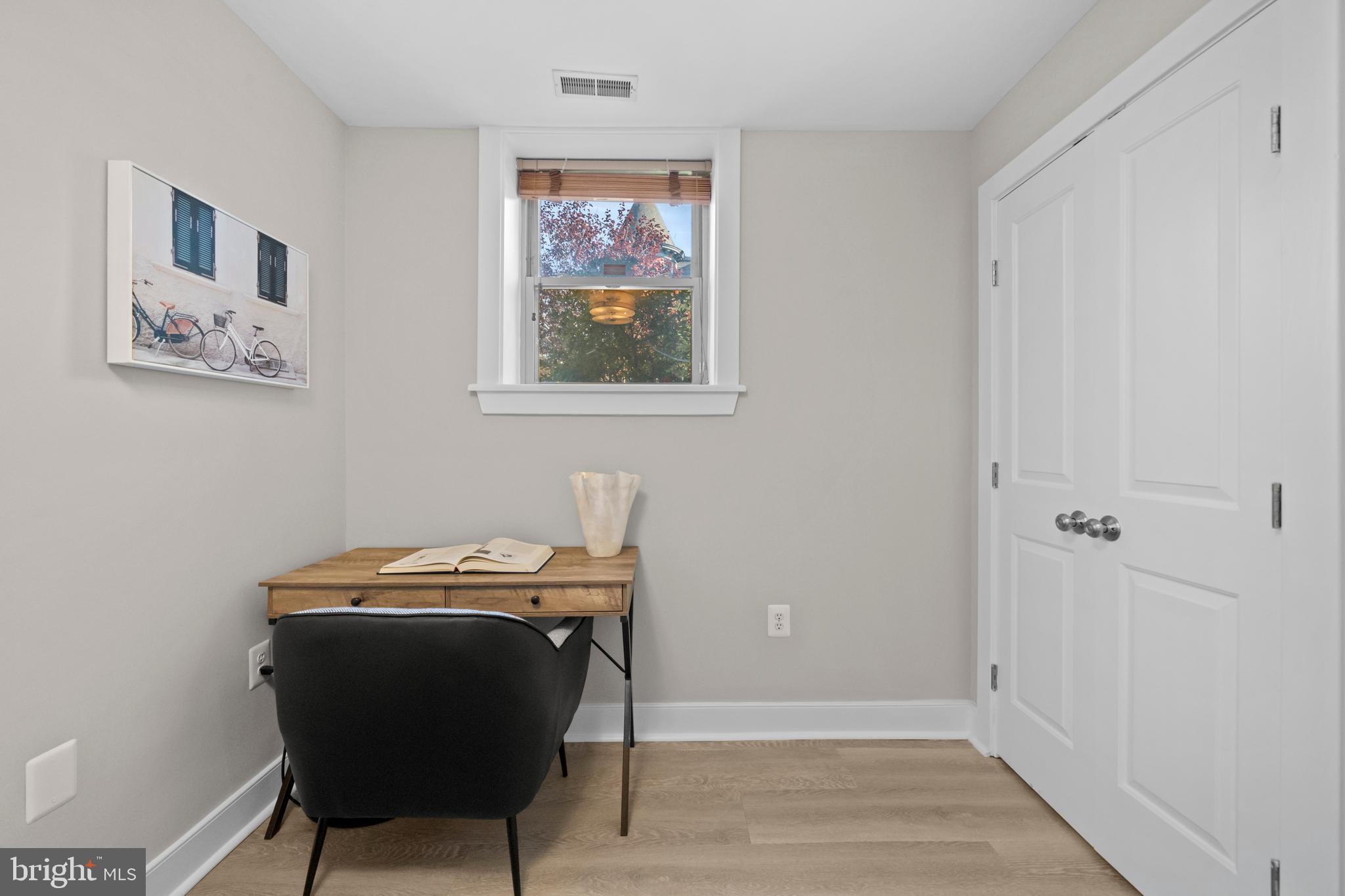 1718 1st Street Northwest, Unit 8 Washington, DC 20001 - Photo 10 of 25 a view of a workspace with furniture and wooden floor