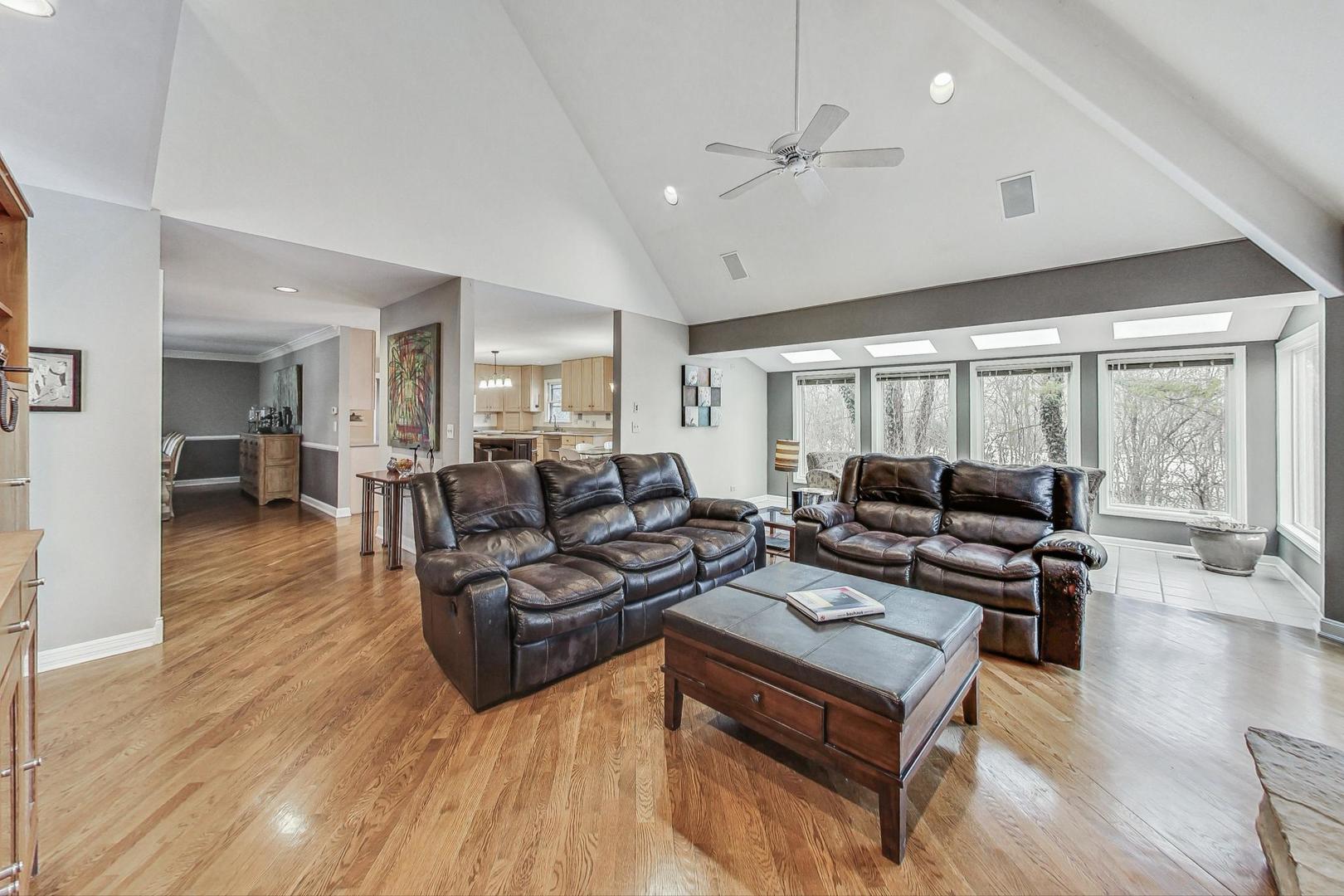 2330 Riverwoods Road Deerfield, IL 60015 - Photo 18 of 50 a living room with furniture and wooden floor