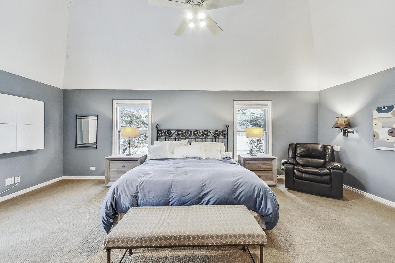 2330 Riverwoods Road Deerfield, IL 60015 - Photo 21 of 50 a bedroom with a large bed and a couch