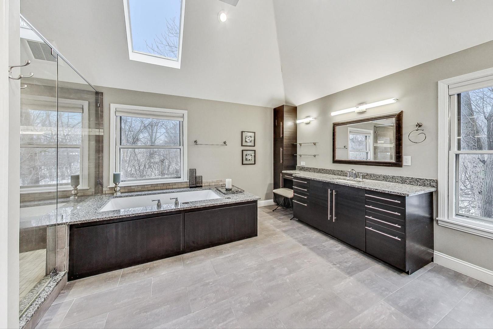 2330 Riverwoods Road Deerfield, IL 60015 - Photo 23 of 50 a large bathroom with a large tub and sink