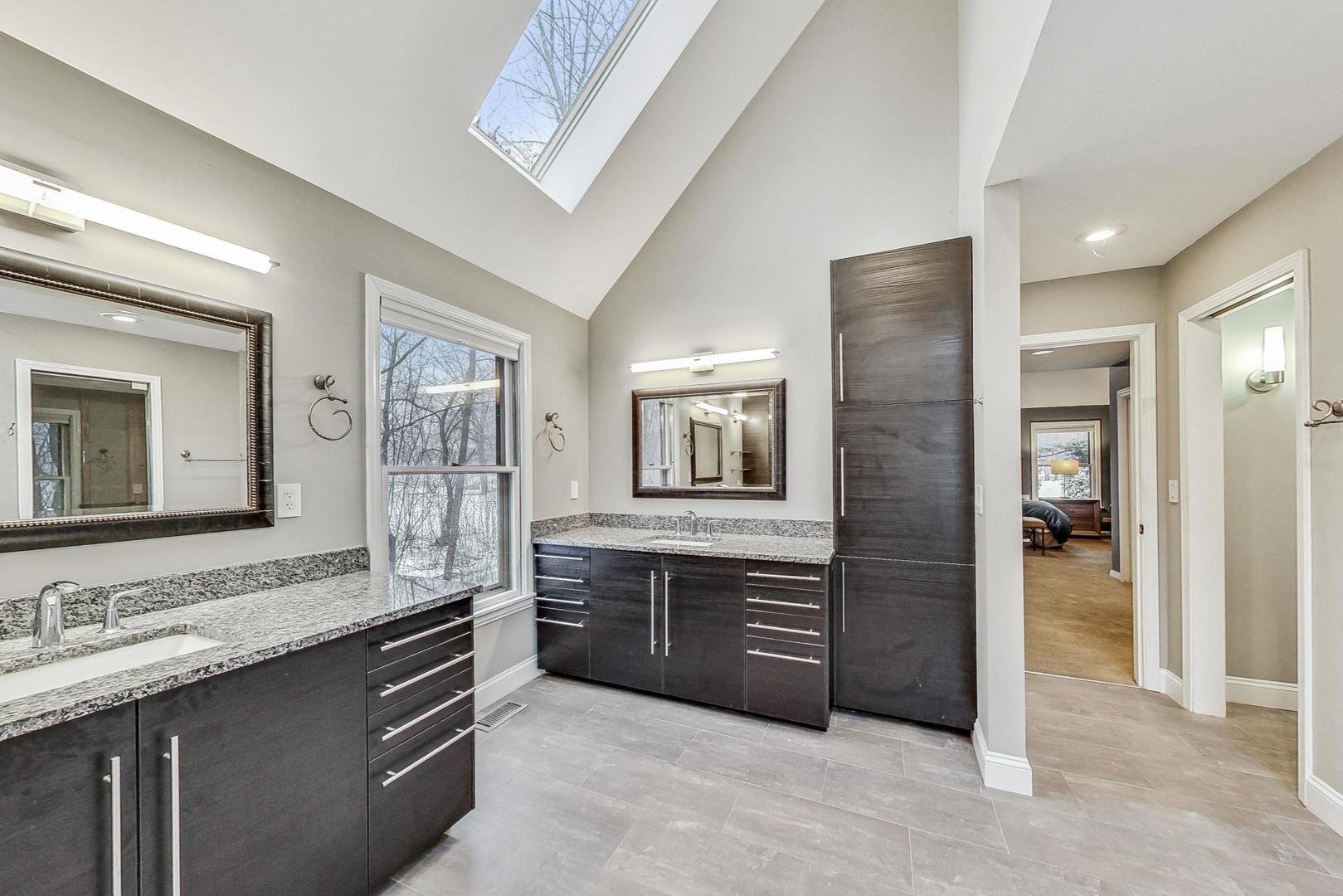 2330 Riverwoods Road Deerfield, IL 60015 - Photo 24 of 50 a spacious bathroom with a granite countertop sink mirror and