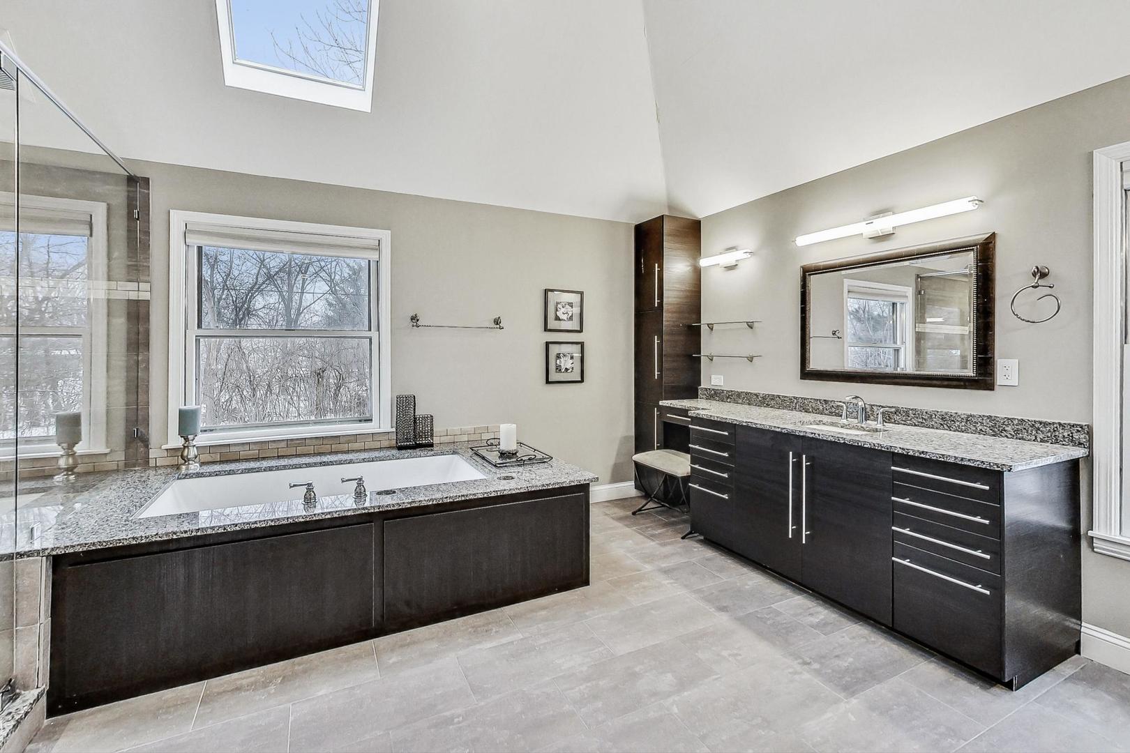 2330 Riverwoods Road Deerfield, IL 60015 - Photo 25 of 50 a large bathroom with double vanity and a large mirror