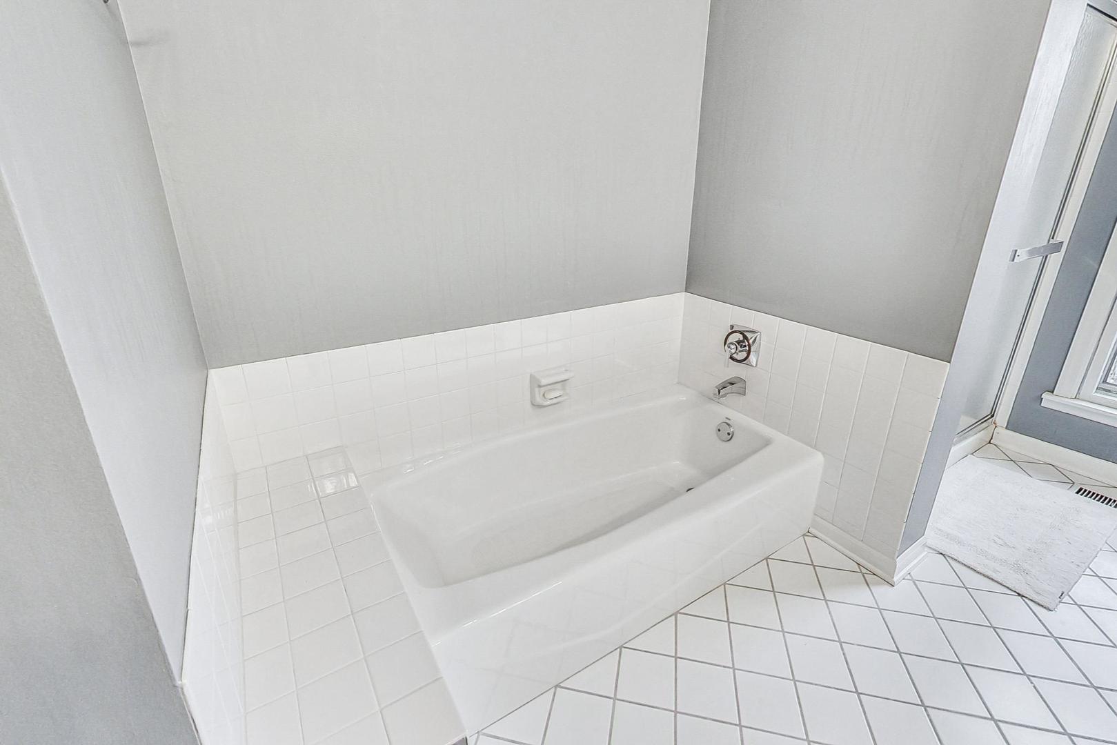 2330 Riverwoods Road Deerfield, IL 60015 - Photo 35 of 50 a bathroom with a bathtub