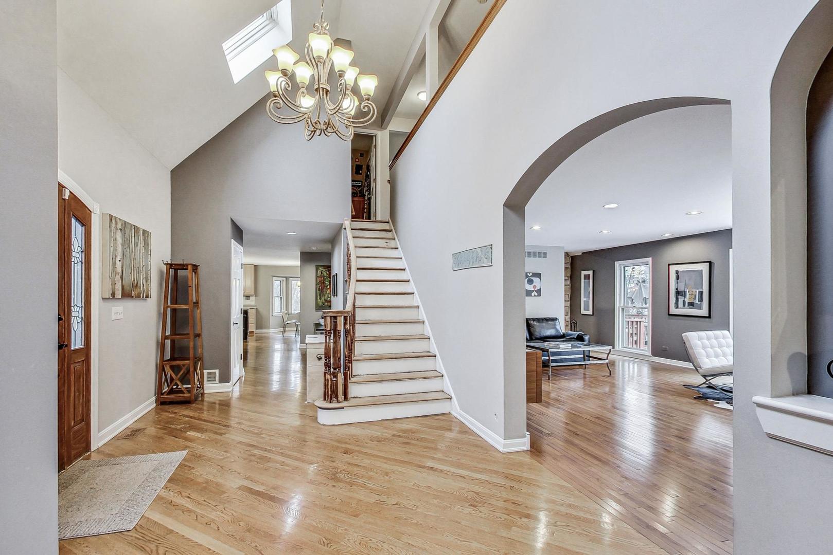 2330 Riverwoods Road Deerfield, IL 60015 - Photo 4 of 50 a view of a livingroom with stairs and furniture