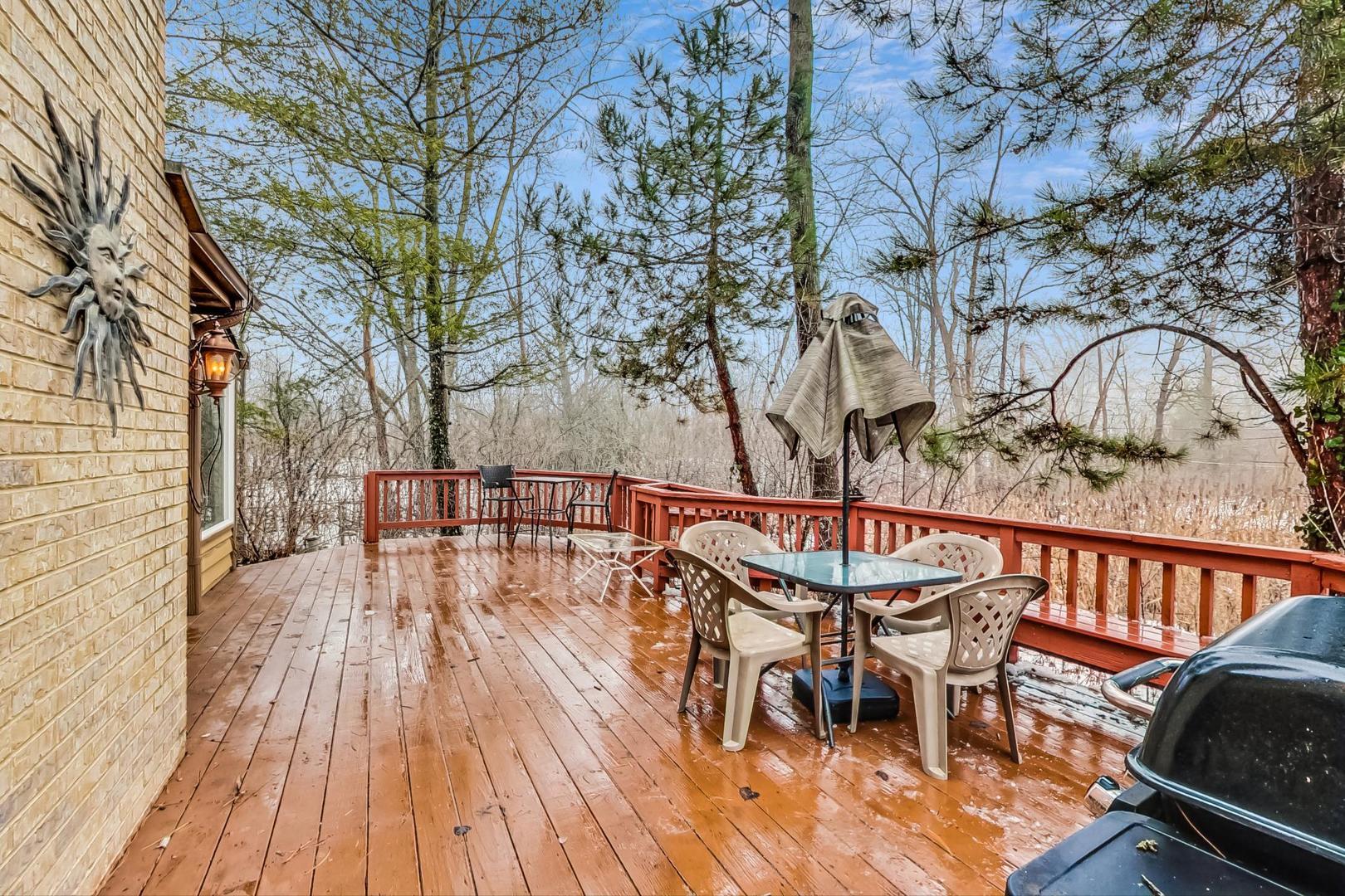 2330 Riverwoods Road Deerfield, IL 60015 - Photo 42 of 50 a view of a chairs and table on the deck