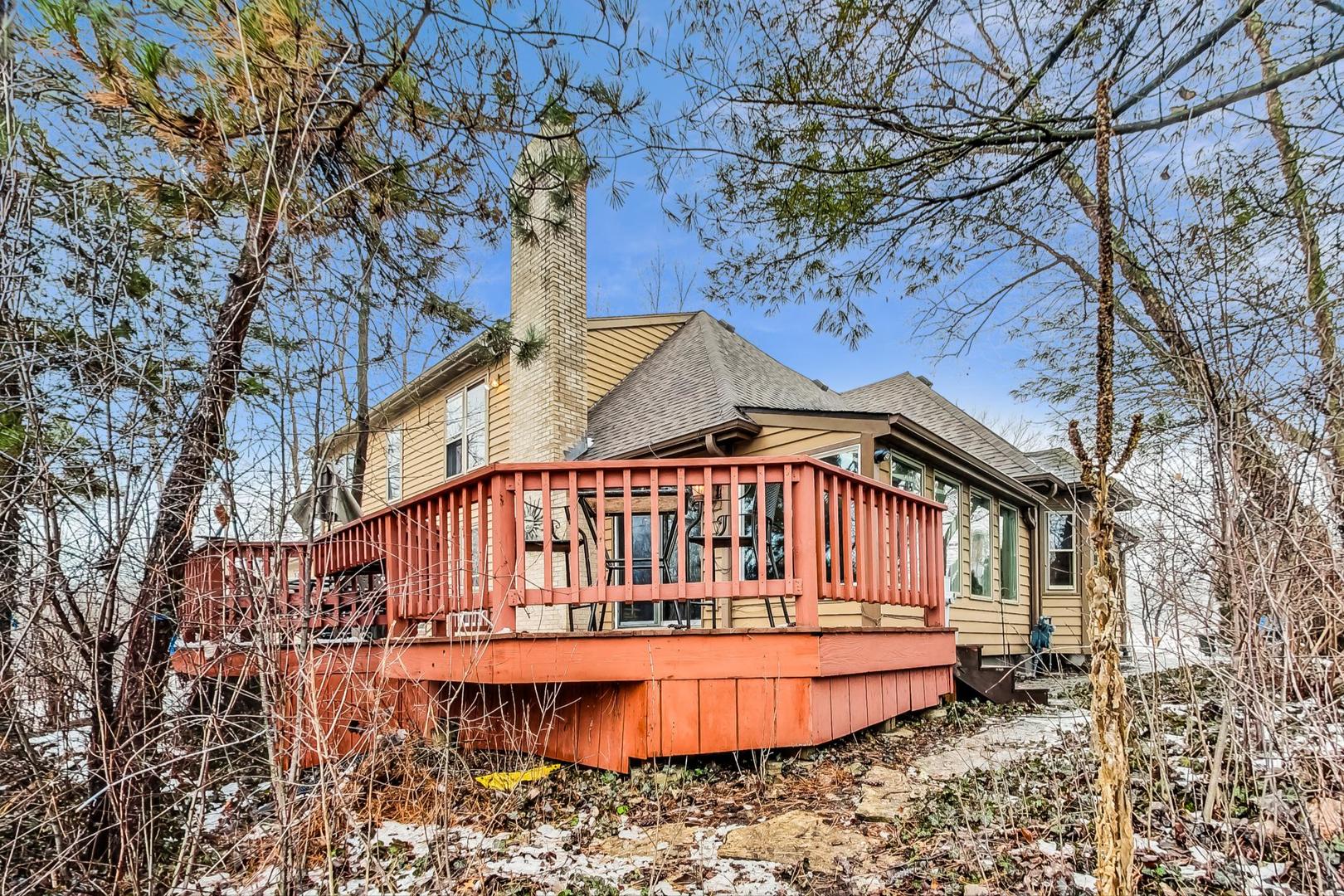 2330 Riverwoods Road Deerfield, IL 60015 - Photo 45 of 50 a backyard of a house with a yard and balcony